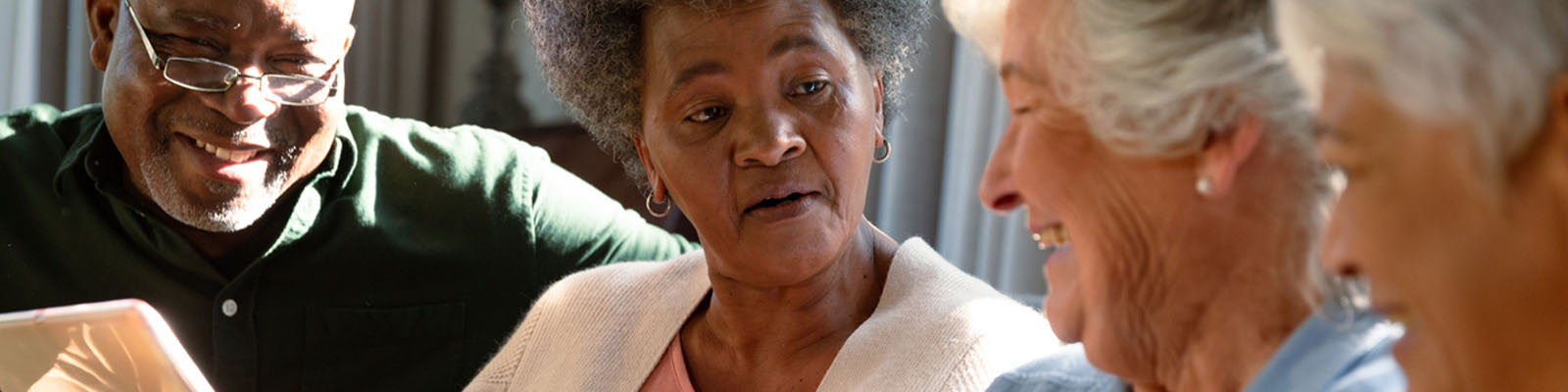 Four senior living residents talking