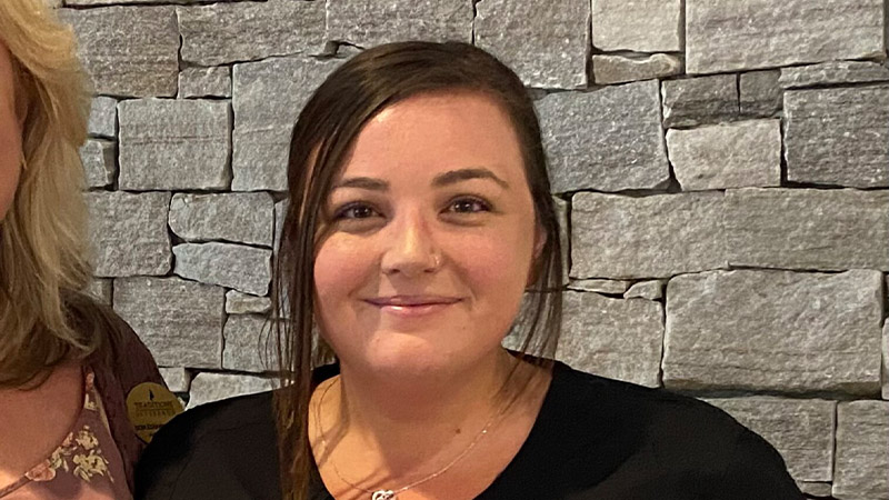 Traditions of Lebanon employee of the month smiling indoors
